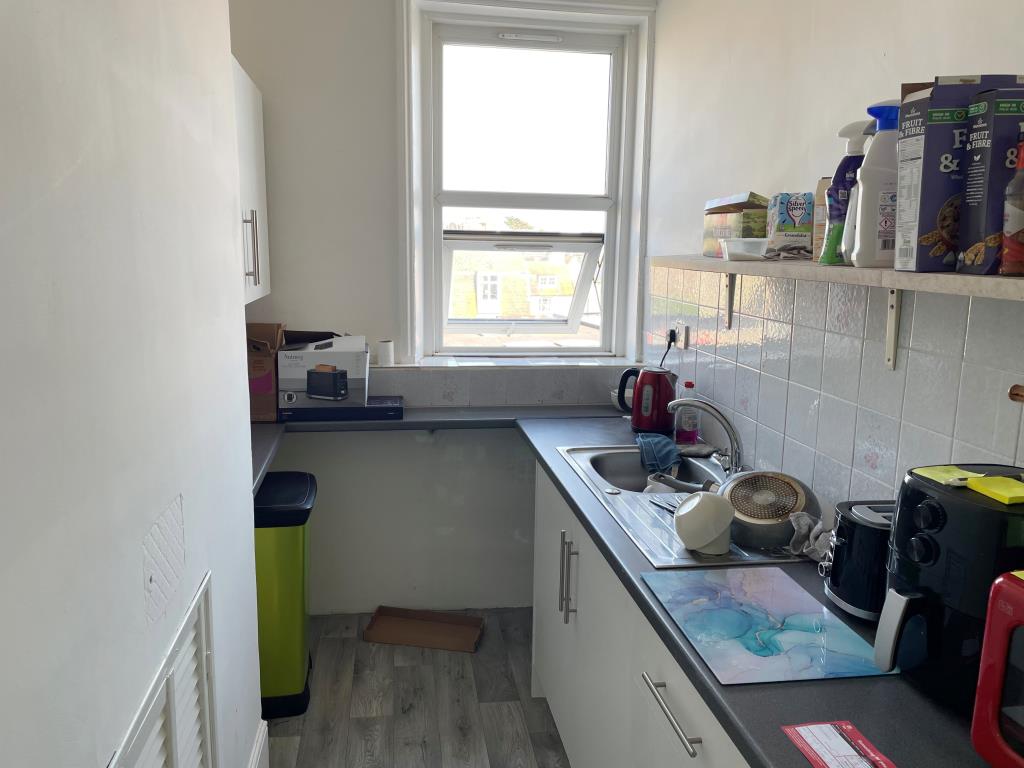 Lot: 29 - FLAT WITH SEA VIEWS FOR INVESTMENT - rear kitchen with worktops and window with views